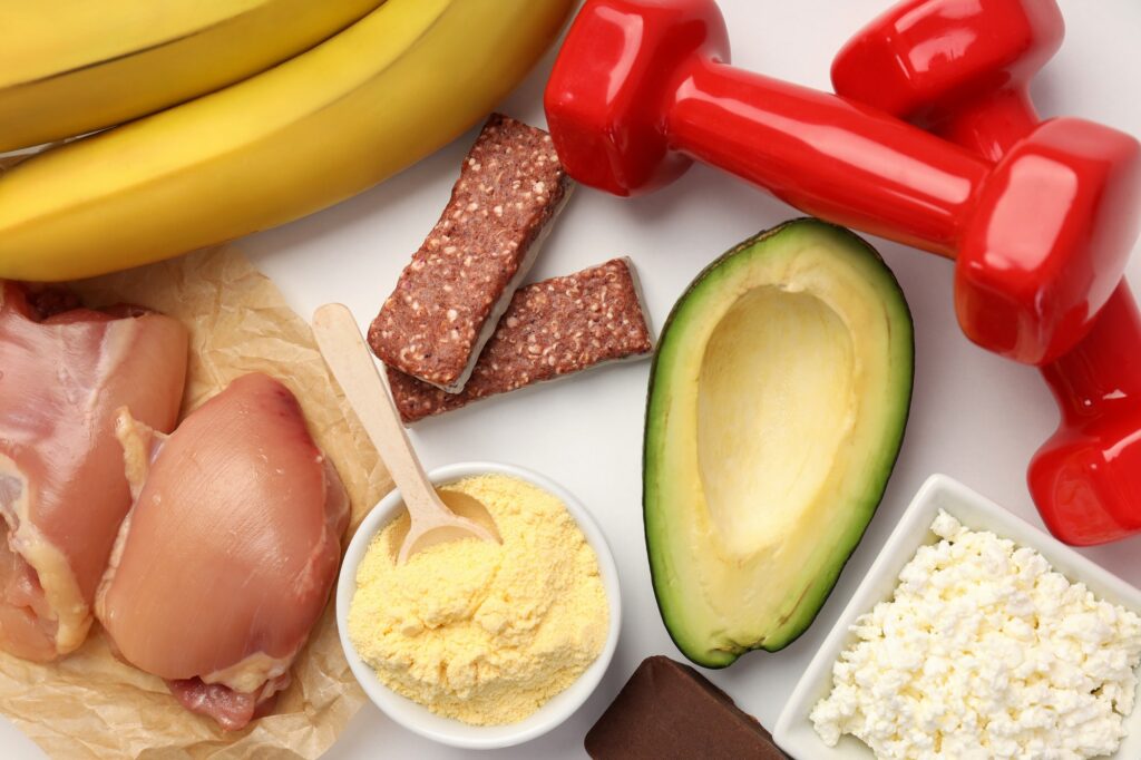 Concept of sports nutrition on white background, top view